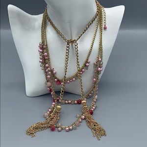 Two necklaces pink and gold.